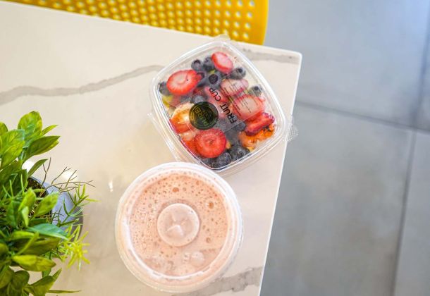 mixed_fruit_and_small_smoothie_on_table